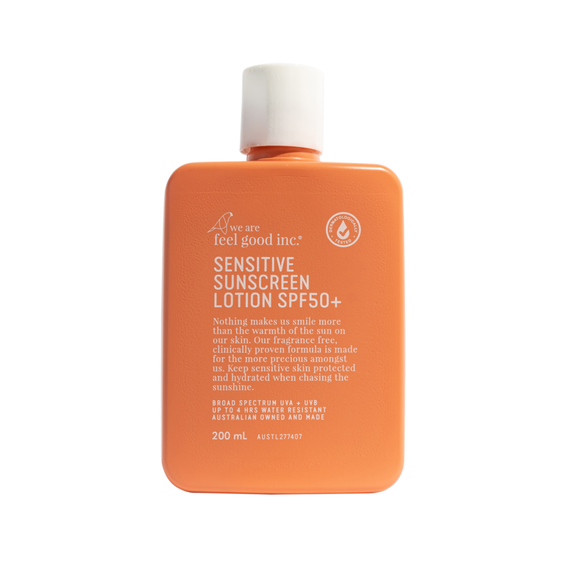 Orange sunscreen lotion bottle with white cap on a white background