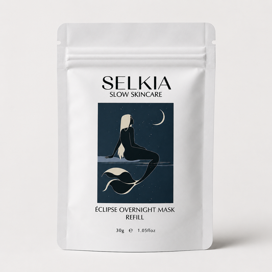 A white stand-up pouch of SELKIA Slow Skincare Eclipse Overnight Mask Refill, featuring a dark blue graphic of a mermaid and moon on the front, set against a light gray background.